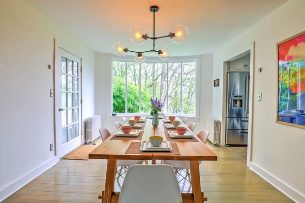 Dining room table with bay window.