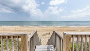 A wooden boardwalk leading to a beach with a clear view of the ocean. - Tipsy Mermaid | Oceanfront | Private Pool, Hot Tub | Nags Head (Nags Head)