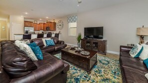 Flat-screen TV, video game console, DVD player, table football