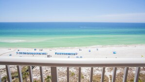 A beach view from a balcony with a railing, clear sky, and calm sea. - Grand Panama Resort Direct Beachfront 3 Bed with Bunks and Amazing Views (Panama City Beach)