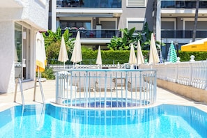 Seasonal outdoor pool, pool umbrellas, sun loungers
