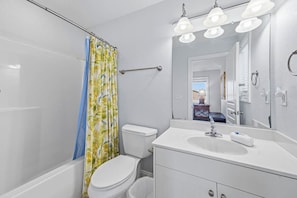 Combined shower/bathtub, towels, soap, toilet paper