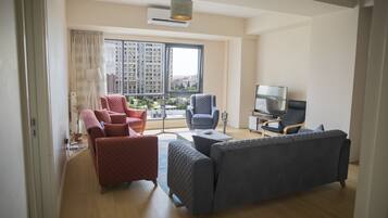 Comfort Apartment, Garden View | Living room | 42-inch LED TV with premium channels, TV