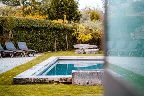 Seasonal outdoor pool, pool loungers
