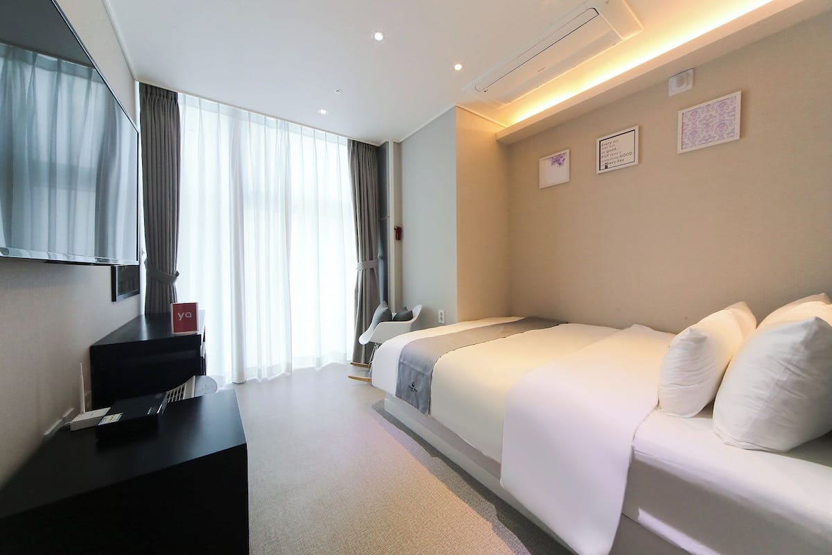 Double Room, City View | 1 bedroom, down comforters, individually decorated