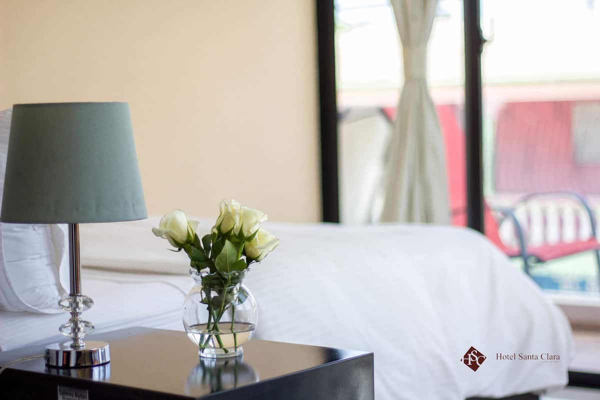 Deluxe Room, Courtyard View | Minibar, desk, laptop workspace, blackout drapes