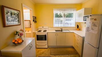 Fridge, oven, cookware/dishes/utensils