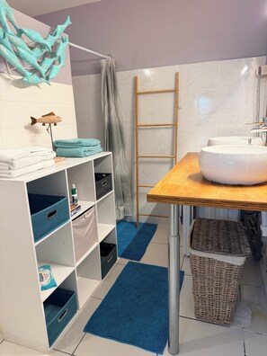 Shower, hair dryer, towels, toilet paper