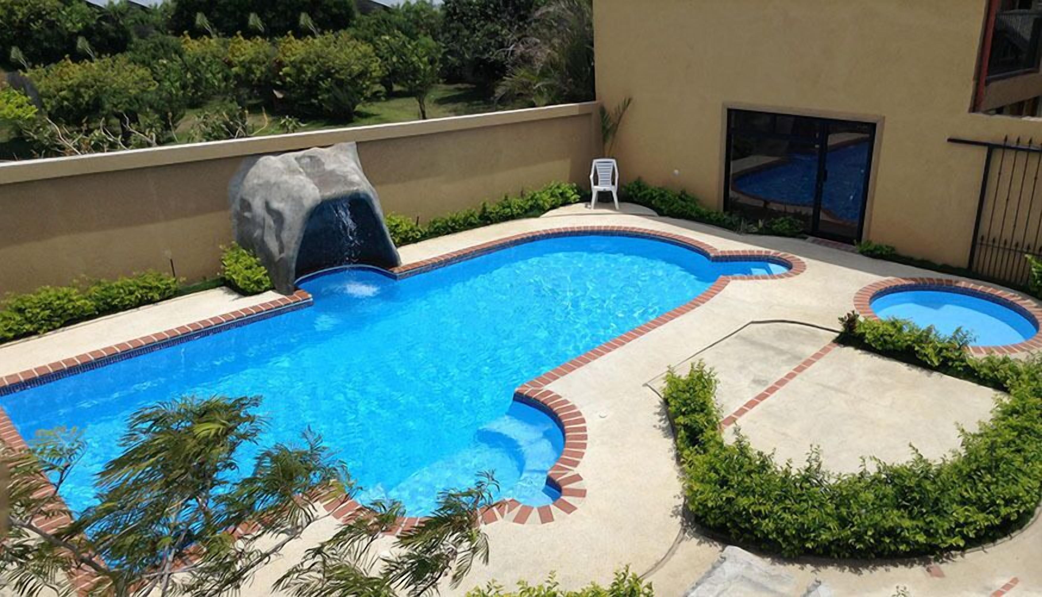 outdoor pool, open 7:30 am to 8:00 pm, pool loungers