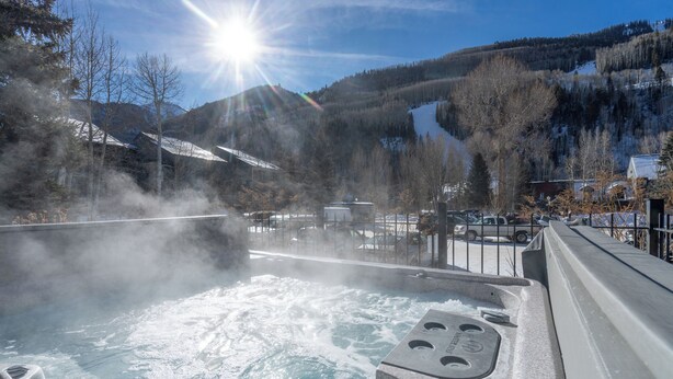 A hot spring area with steam rising from the water, surrounded by mountains and trees. - Beautiful 3 bedroom Condo close to Lift 7 (Telluride)