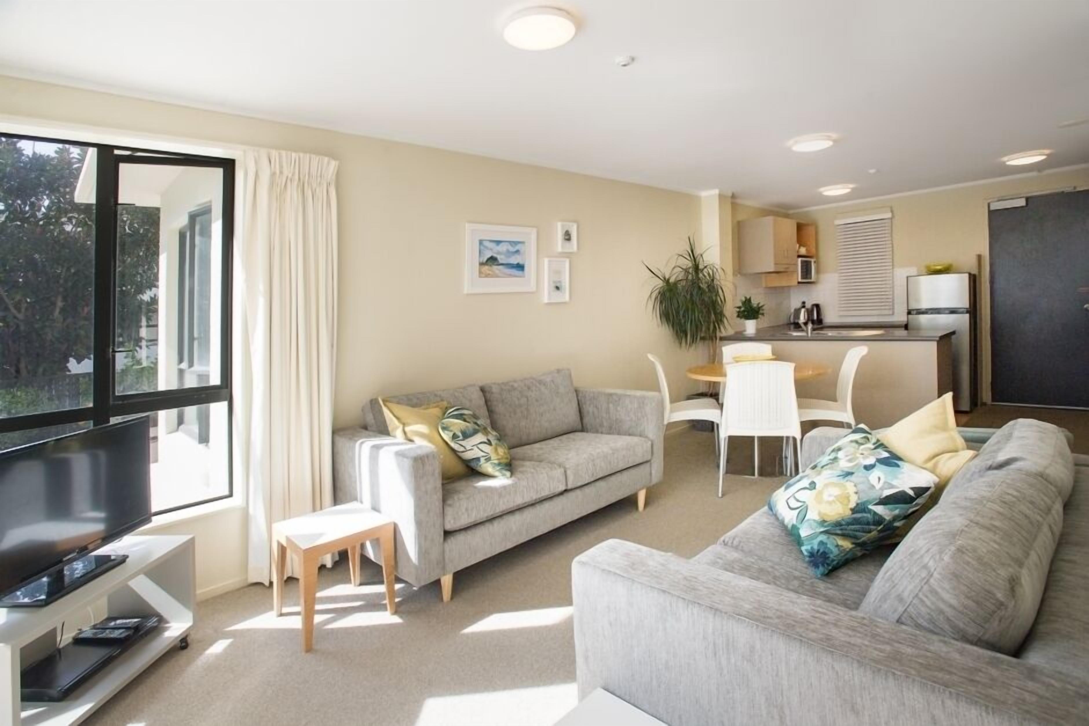 Living, dining and kitchen in the Abode, Apt 104