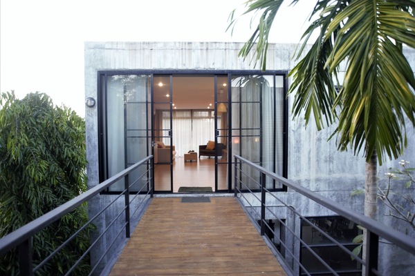 Across the elevated bridge and into your private apartment