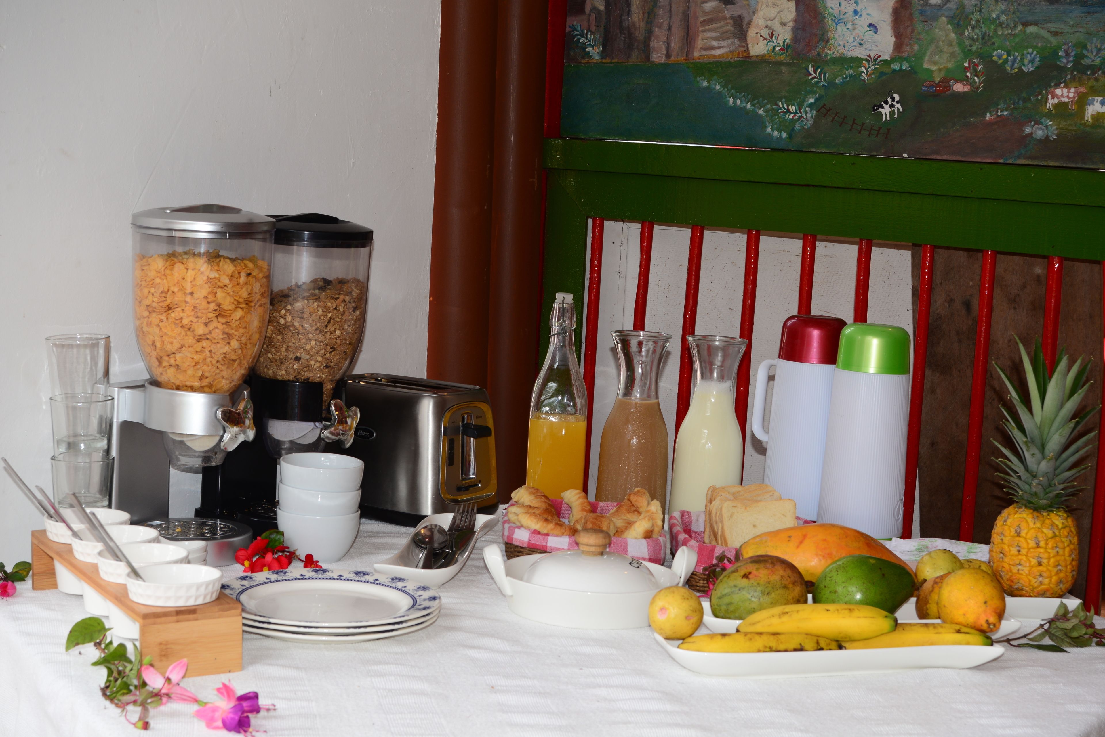 A breakfast buffet with various food items and beverages.