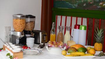 A breakfast buffet with various food items and beverages.