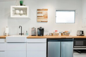 Fridge, microwave, stovetop, coffee/tea maker