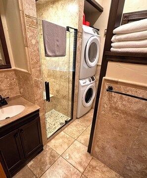 Shower, hair dryer, towels, soap