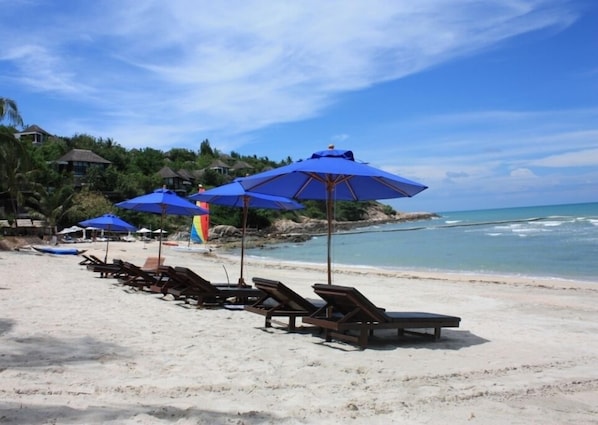 On the beach, sun loungers, beach towels