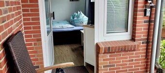 Daubs Inseloase – Apartment 4 mit Terrasse, tierfrei & strandnah