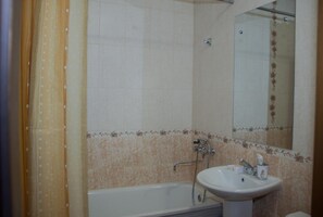 Separate tub and shower, deep soaking tub, hair dryer, slippers