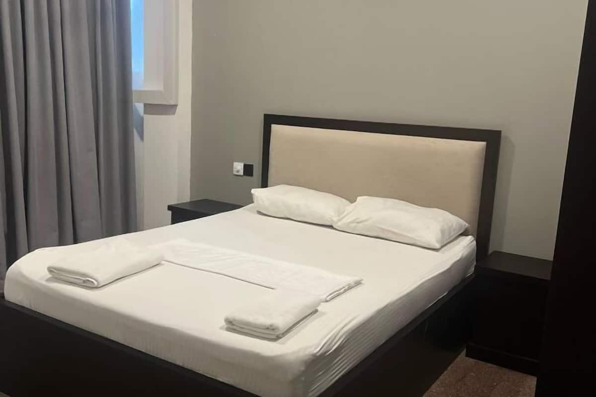Premium bedding, blackout curtains, iron/ironing board, free WiFi