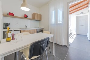 Family Apartment, 1 Bedroom, Non Smoking, Partial Sea View | Private kitchen | Oven, coffee/tea maker, electric kettle, toaster - Rotunda Suites (Chania)