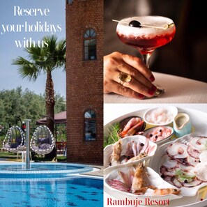 A poolside view of a resort with a brick building, hanging chairs, and a clear blue pool.