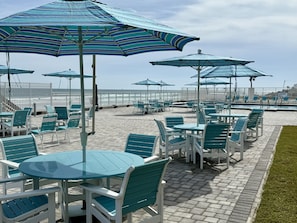 Outdoor dining - An adorable, direct oceanfront front studio with a large private balcony. (Daytona Beach)