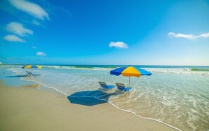 On the beach, sun-loungers
