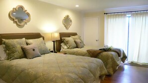 A room with two beds, each with a headboard and pillows, a nightstand with a lamp, and a window with curtains. - Extra Clean Next Beech Mountain Ski Resort (Beech Mountain)