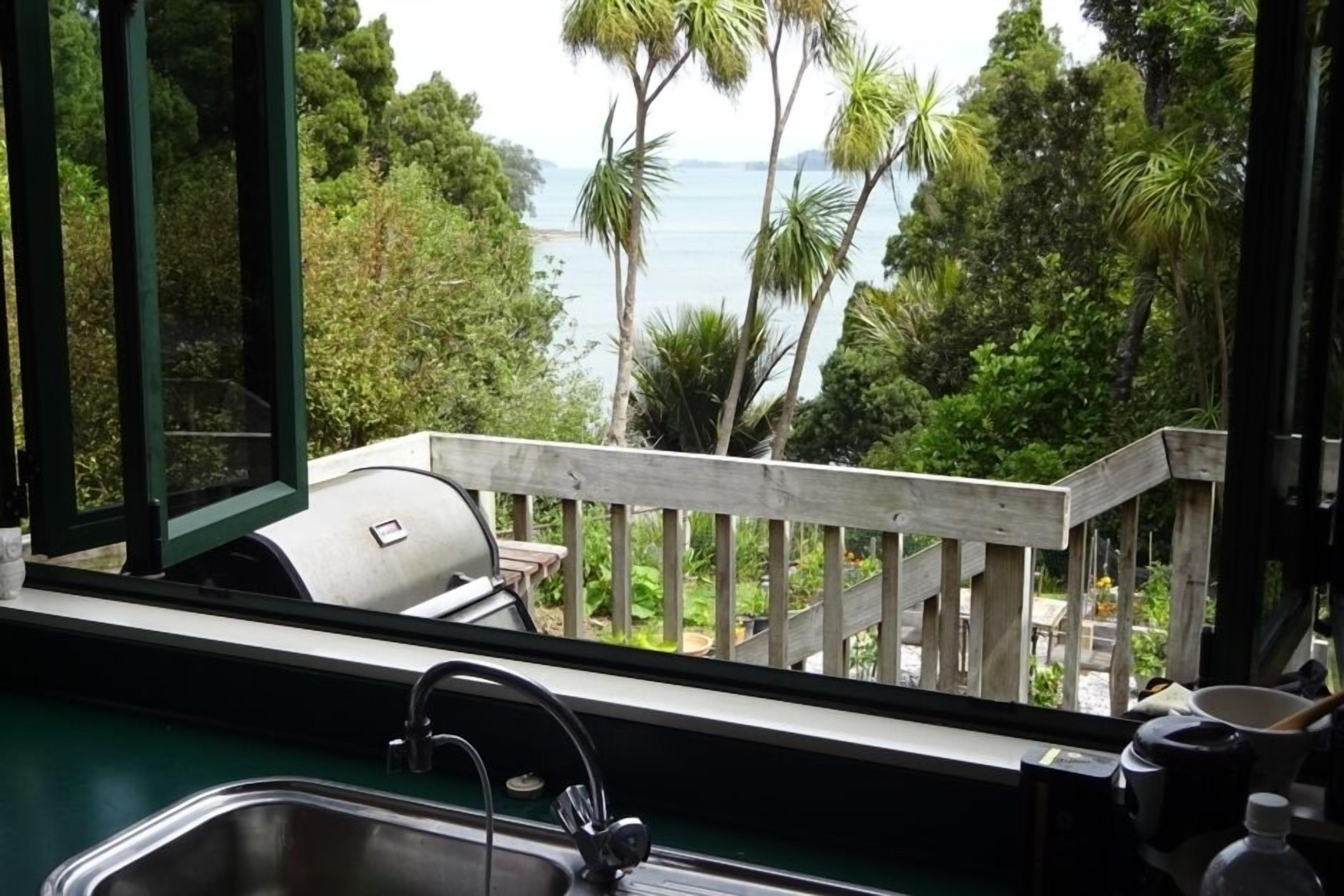 Throw back the kitchen bifolds to the deck andamp; sea.