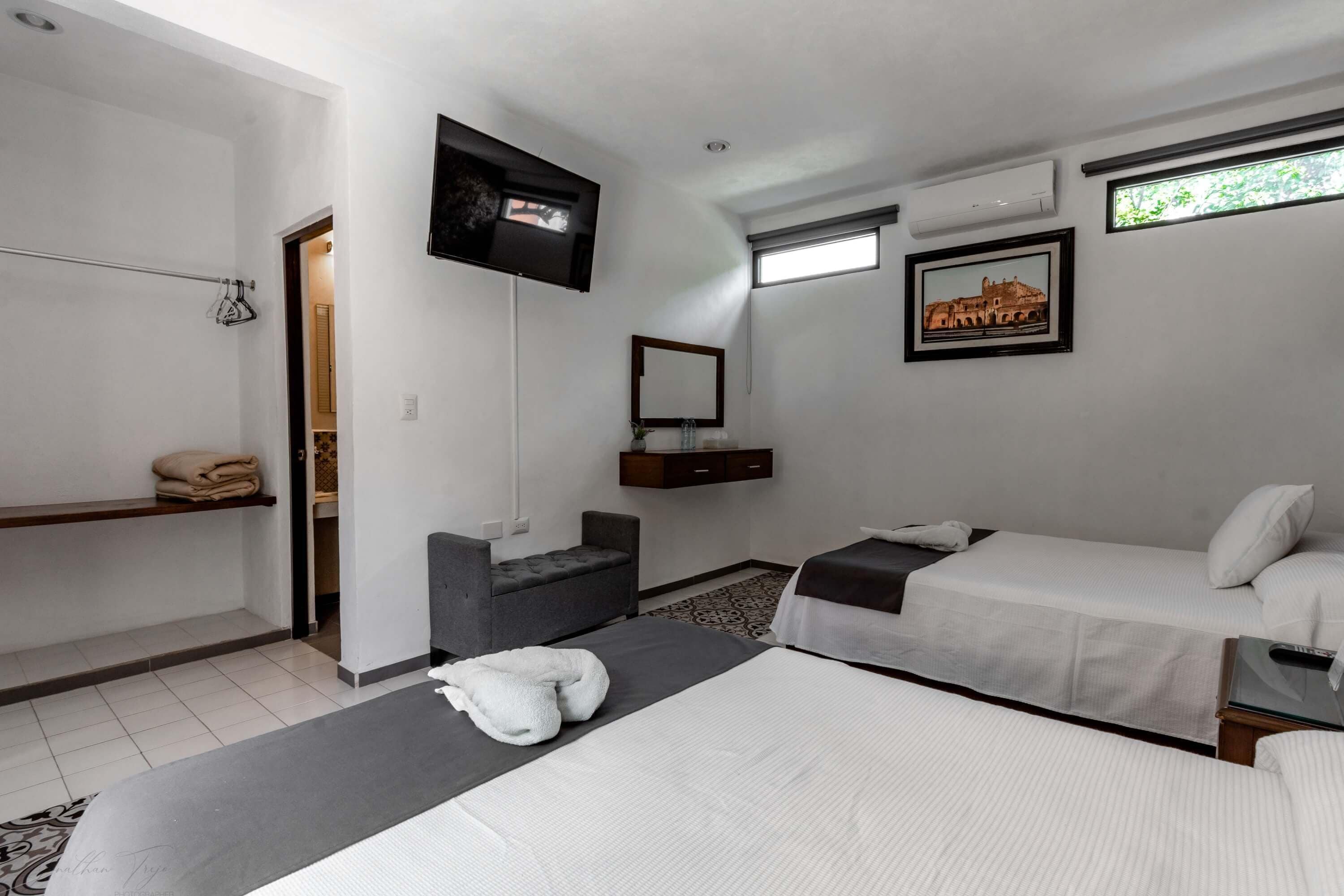 family double room, 2 double beds, private bathroom, city view | premium bedding, down duvets, tempur-pedic beds, individually decorated