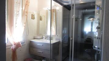 Shower, jetted tub, hair dryer, bidet