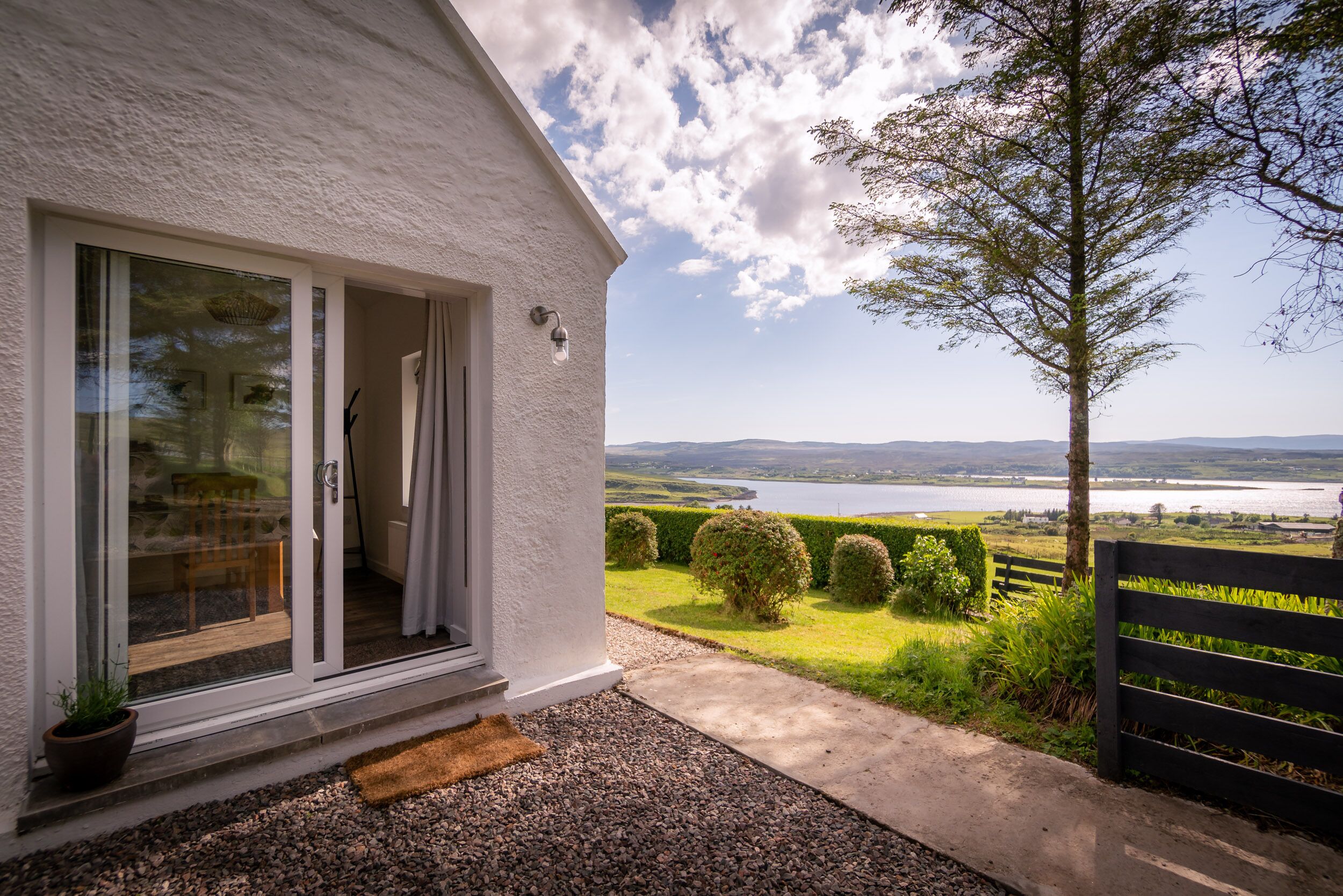 French doors leading into private garden and seating area