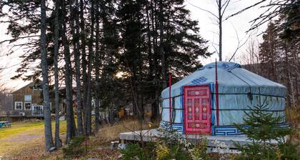 Small red yurt at Cabot Shores Wilderness Resort