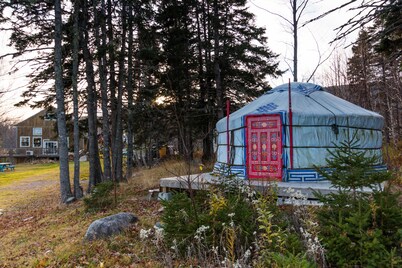Small red yurt at Cabot Shores Wilderness Resort