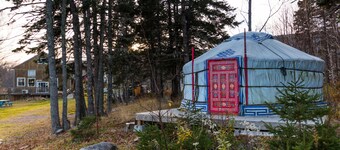 Small red yurt at Cabot Shores Wilderness Resort