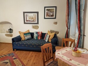 Suite junior | Área de sala de estar | Televisión de pantalla plana 