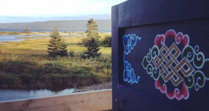 Small blue yurt at Cabot Shores Wilderness Resort