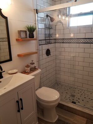 Shower, hair dryer, towels, soap