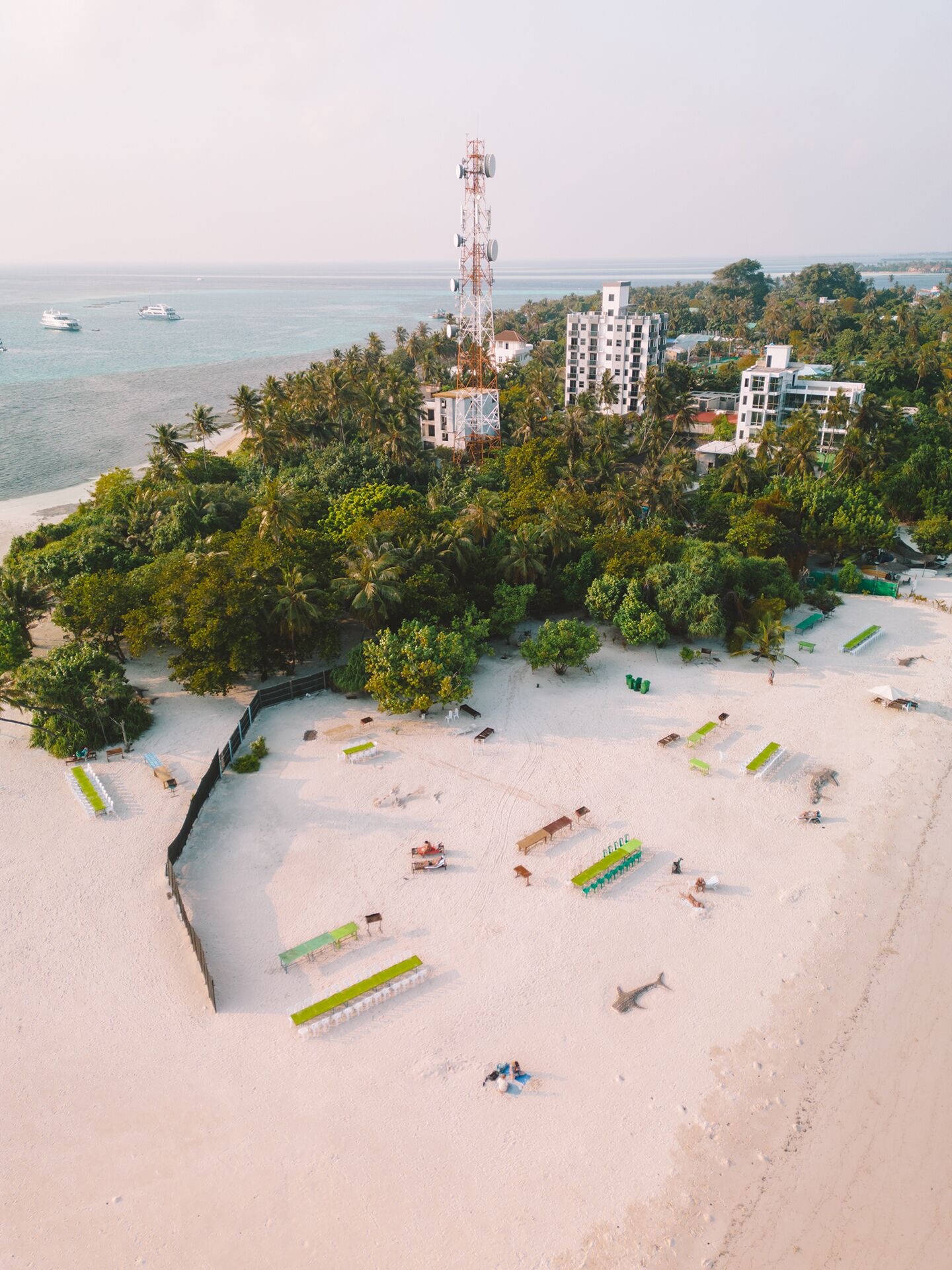 White sand, beach towels