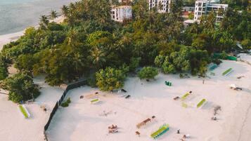 White sand, beach towels