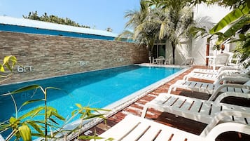 Outdoor pool, pool umbrellas, sun loungers