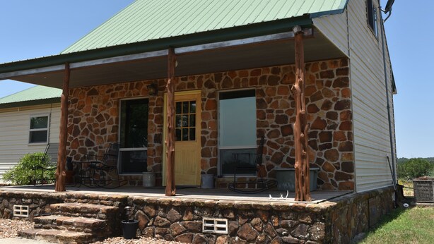 A two-story house with a stone facade and a green metal roof. - Rustic Loyal Valley Private Guesthouse with Peace & Serenity Views (Mason)