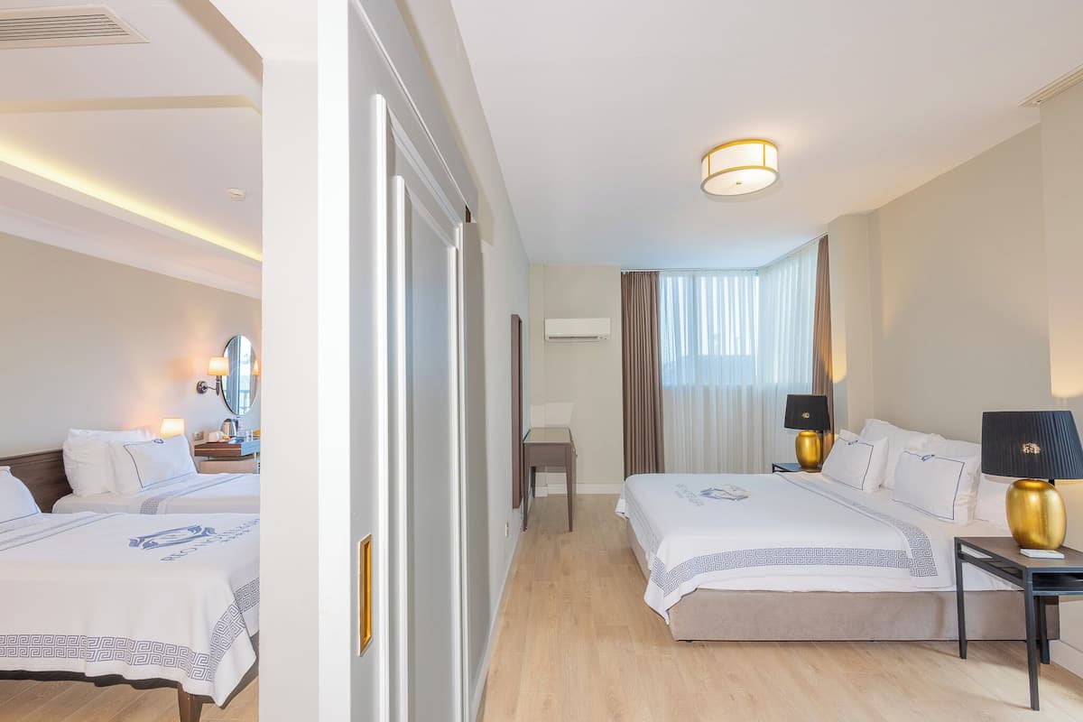 Family Quadruple Room, Multiple Beds | Minibar, in-room safe, desk, laptop workspace
