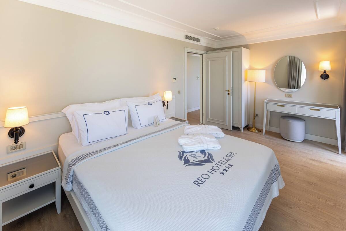 Family Suite with Sea View | Minibar, in-room safe, desk, laptop workspace