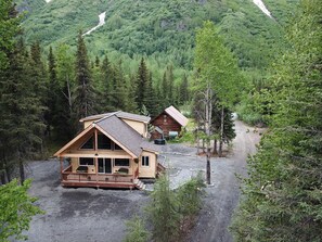 Front, aerial view of the cabin. Upper Paradise Log Cabin is in the background.