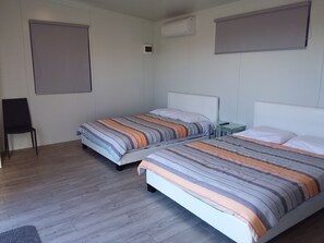 Habitación Deluxe con 1 cama doble o 2 individuales | Cortinas opacas y sistema de insonorización