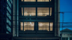A multi-story building with large windows and a ground-level entrance. - Node Hotel (Kyoto)