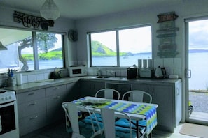 Fridge, microwave, oven, coffee/tea maker - "Beside The Sea."More than an apartment! Absolute waterfront. Swim steps away. (Urquharts Bay)