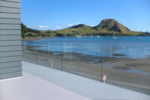 On the beach, beach towels - "Beside The Sea."More than an apartment! Absolute waterfront. Swim steps away. (Urquharts Bay)